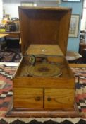 A traditional table top and oak cased Gramophone Record Player.