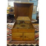 A traditional table top and oak cased Gramophone Record Player.