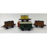 Four Hornby gauge 0 post war wagons, 1948-1951 flat truck with container GW in original 1950 (marked