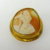 An antique cameo brooch in yellow metal.