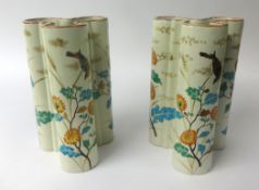 E. Gallé, a pair of pottery tri-form vases, richly decorated with flowers and gilt work, signed to