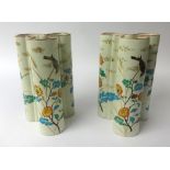 E. Gallé, a pair of pottery tri-form vases, richly decorated with flowers and gilt work, signed to