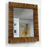 A parquetry inlaid rectangular wall mirror.