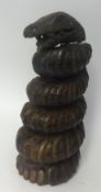 A carved wood coiled snake, height 51cm