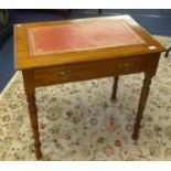 Edwardian oak side table with leather writing surface fitted with a single drawer, width 76cm.