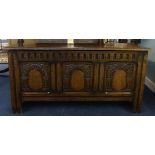 A reproduction 'stressed' oak blanket chest, width 114cm.