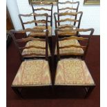 A set of six Georgian style ladder back and oak framed dining chairs.