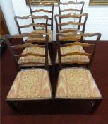 A set of six Georgian style ladder back and oak framed dining chairs.