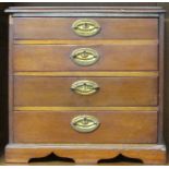 MINIATURE MAHOGANY CHEST OF FOUR DRAWERS WITH METAL HANDLES