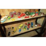 TWO SHELVES OF VINTAGE DIE-CAST VEHICLES INCLUDING DINKY AND CORGI, TOGETHER WITH FUEL PUMPS AND