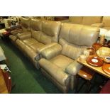 THREE PIECE MANUALLY RECLINING SUITE COMPRISING TWO SEATER SOFA AND TWO ARMCHAIRS IN LIGHT TAN