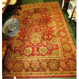 LARGE HAND KNOTTED INDIAN RECTANGULAR RED AND PALE GOLD GROUND FOLIATE PATTERNED FLOOR RUG WITH