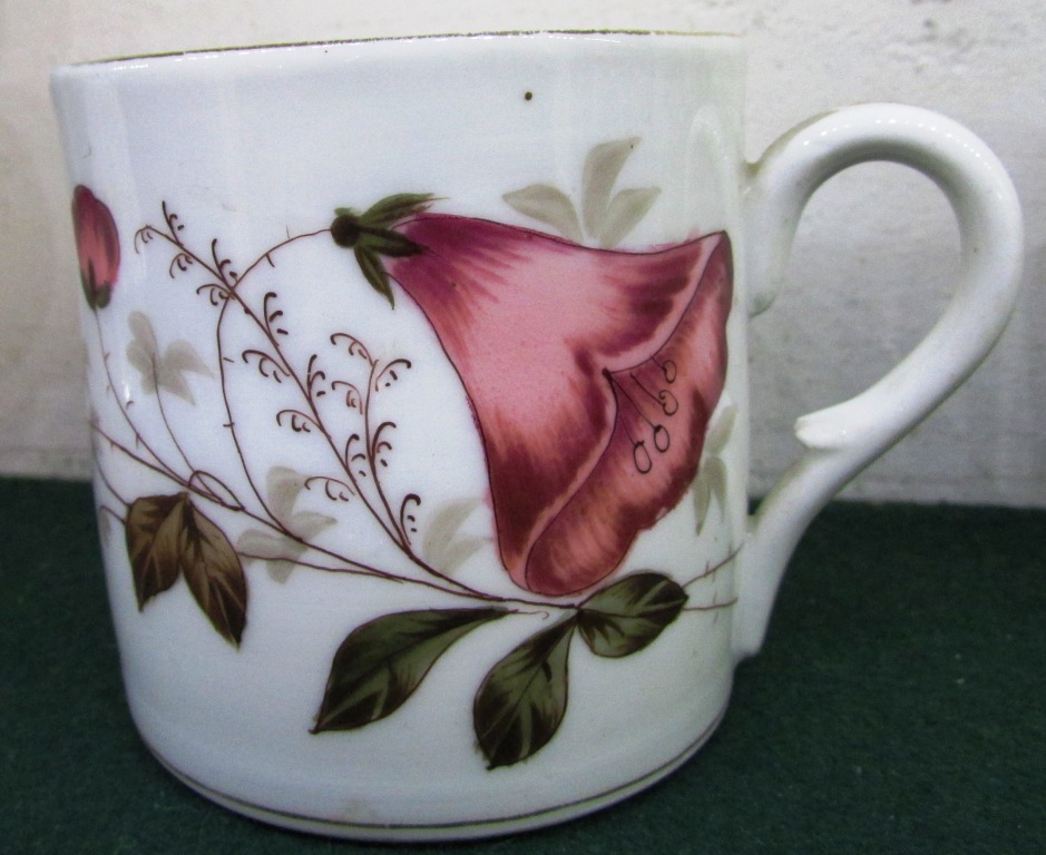 CHINA TEACUP DECORATED WITH FLOWER WITH 'WATERMARK' IMAGE TO BASE