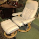 EKORNES STRESSLESS SWIVEL RECLINING ARMCHAIR AND FOOTSTOOL IN BEIGE LEATHER UPHOLSTERY (ONE OF A