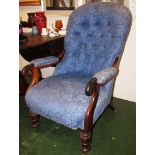 VICTORIAN BUTTON BACK FIRESIDE CHAIR WITH MAHOGANY FRAME, TURNED FRONT LEGS AND BRASS CASTORS