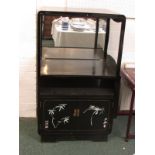 A far Eastern black lacquered cabinet, the large top compartment open to the front with mirrored