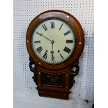 A circular chiming Victorian kitchen chiming clock with a lower glazed pendulum aperture. The