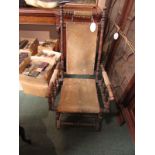 An American rocking chair with spindle turned supports, corded material seat back, arm rests and