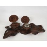 A wooden inkwell carved as a leaf and two nuts, one with a clear glass insert, length 25cm