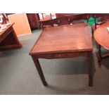 A square dark wood mah jong table on square tapering legs, a recessed top and small drawer to each