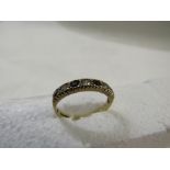 9ct gold ring with a straight setting of three white and four sapphires, British assay marks,