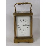 19th century striking and repeating brass corniche carriage clock, the dial signed J.W. Benson 25