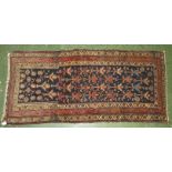 Persian hand knotted semi antique rug in pinks, blues and reds (195cm x 93cm)