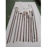 Eleven tribal type spears, the longest 158cm, one example being double-ended with metal shaft
