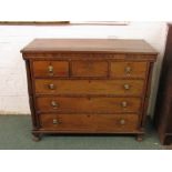 An early 19th century mahogany chest of three short over three long graduated drawers of neo