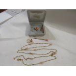 A matched suite of yellow metal jewellery set with coral and pink stone, comprising - yellow metal