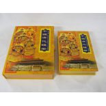 China Coins Ltd China Qing Dynasty Coins set of ten coins set into a book, in yellow decorative case