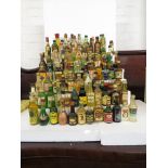 Assorted miniature liqueur bottles including Black Heart Rum, Pimm's, Beefeater Dry Gin and