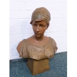 After R Aurili - a plaster bust of young woman with a bronze colour finish on a square base,