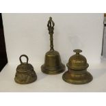 Three brass desk bells and hand bells, one moulded with animals, height of tallest 19cm