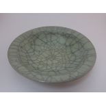 Chinese Guan type circular dish, stoneware with crackled celadon glaze, diameter 17.6cm, depth 4.