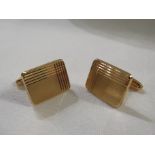 Pair of yellow metal cufflinks with rectangular engine turned faces, stamped 750, 8.7g