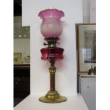 Victorian oil lamp with graduated pink vaseline glass shade etched with stylized bunches of