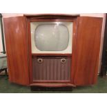 Bush Radio Television Receiver type TUG 69 in a veneered cabinet with two hinged doors,