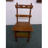 Oak metamorphic library chair and steps with Arts and Crafts styling, four treads with tooled