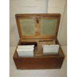 Wooden case containing two mahogany photographic plate holders, developing dishes, bottles and