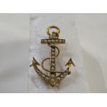 A 15ct gold brooch modelled as an anchor and rope and set with twenty-nine seed pearls, 3cm x 1.8cm,