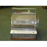 An early 20th century counter top NCR cash register with embossed design, 'THE NATIONAL DAYTON