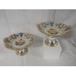 A pair of Coalport porcelain comports on circular feet, the oval bowls with two naturalistically