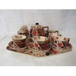 Old Hall earthenware cabaret set decorated in an Imari pattern with butterfly and fish, comprising