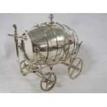 An electroplated table cistern modelled as a cart and barrel, screw stopper to top, rotating wheels,