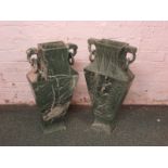 A pair of Chinese style vert antique stone vases of tapering slab form with ring handles at the