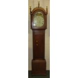 A mid 19th century eight day long case clock in an oak case. The square enamel dial has a floral