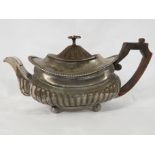 George III silver teapot with fruitwood handle, half-reeded body, on four ball feet, marks for