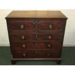 A Georgian mahogany secretaire chest of four drawers on bracket feet. The secretaire drawer