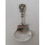 A Victorian silver caddy spoon with a mask head stem, the plain bowl bears the marks for Birmingham,